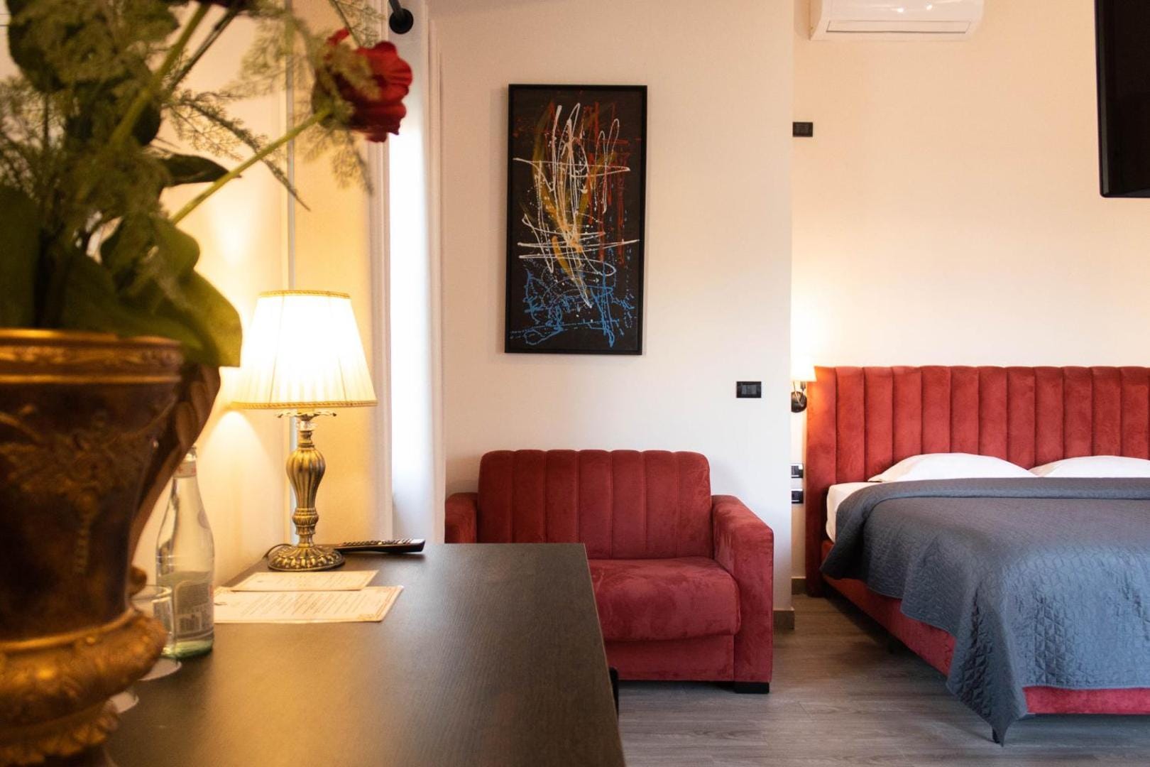 The red sofa by the bed