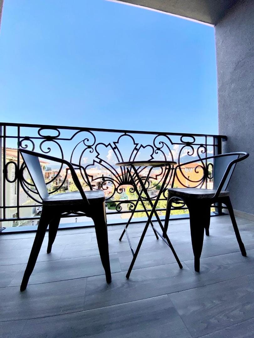 Two chairs by the window