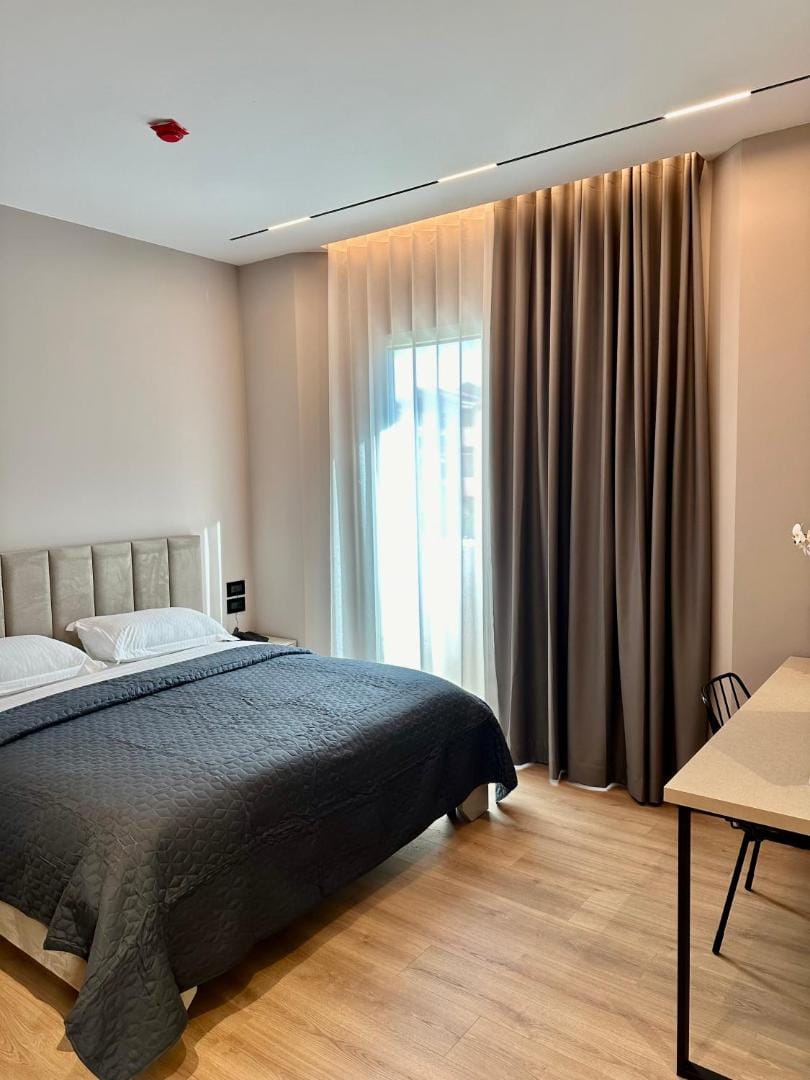 Bed under a large window