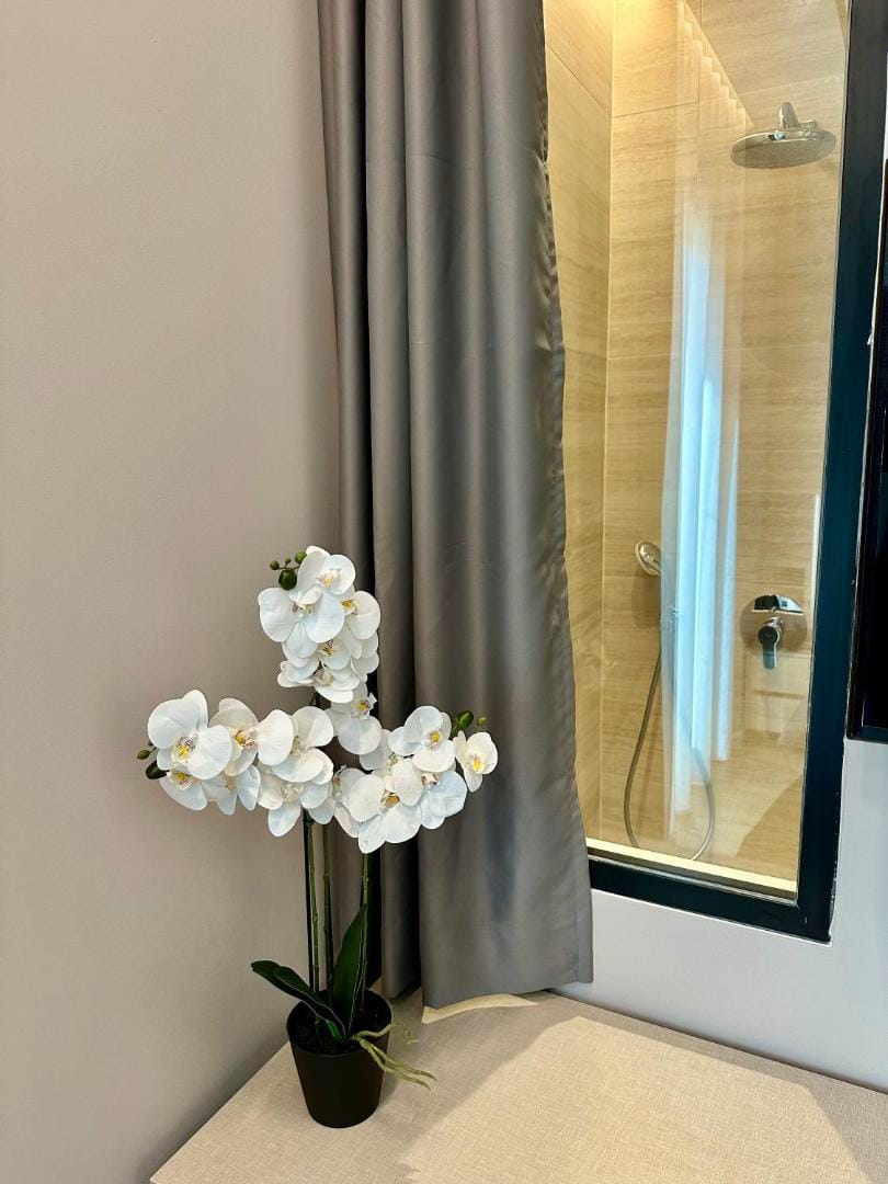 White flowers in front of the shower