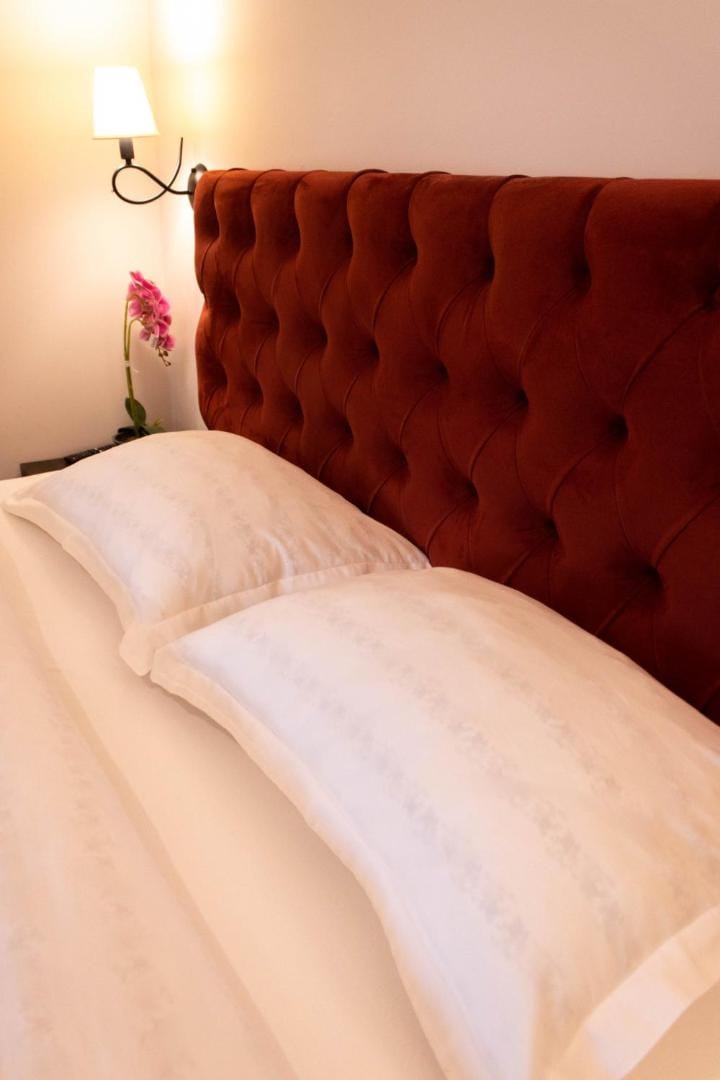 Bed with a brown headboard
