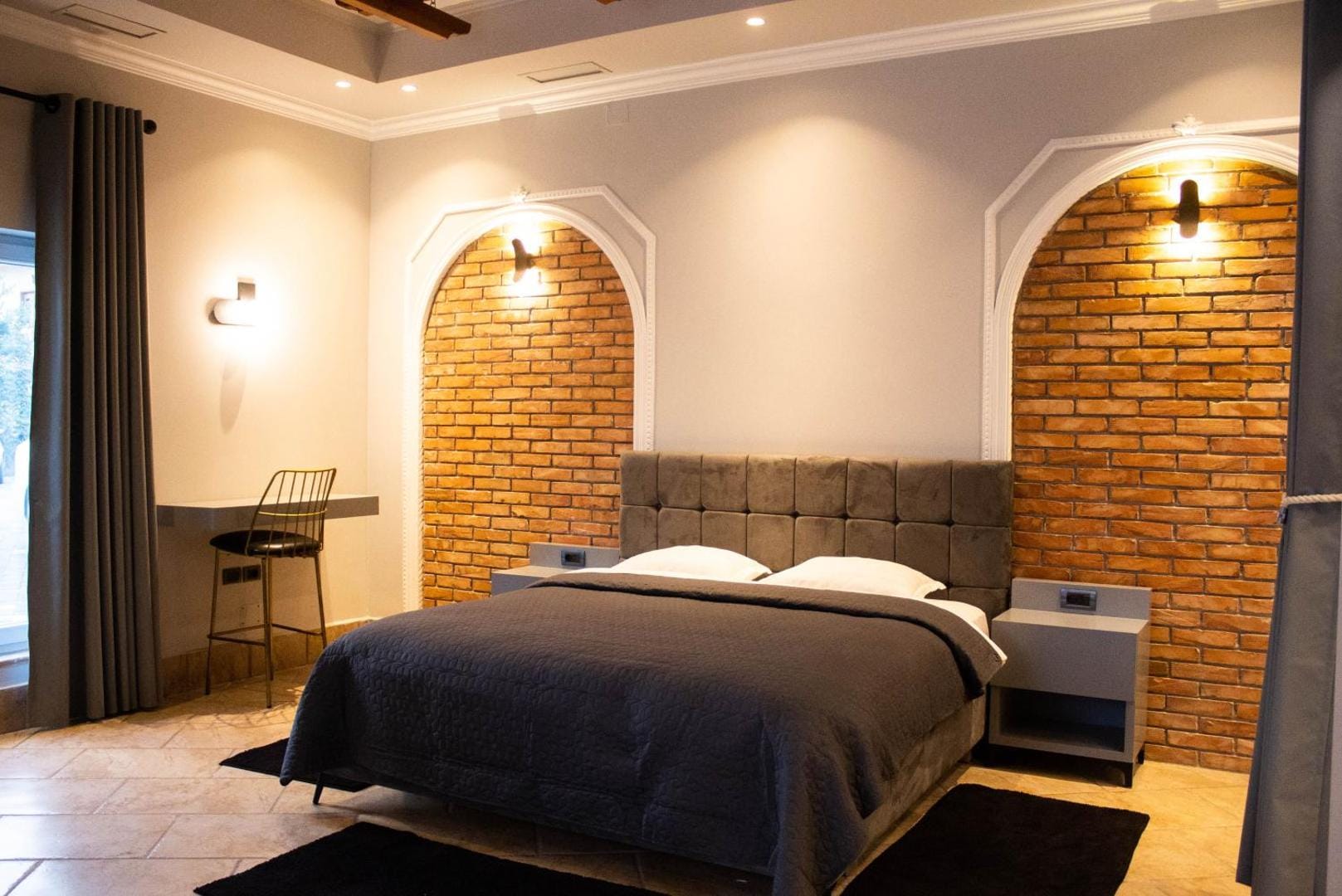 Bed against the exposed brick arch