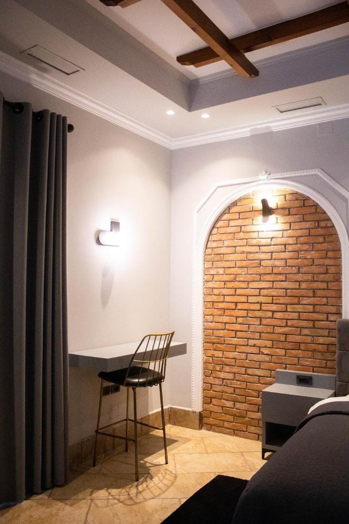 An armchair against the brick