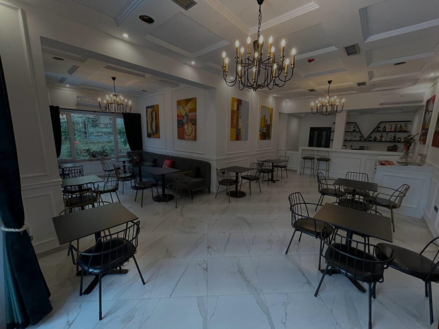 The dining room under its chandelier