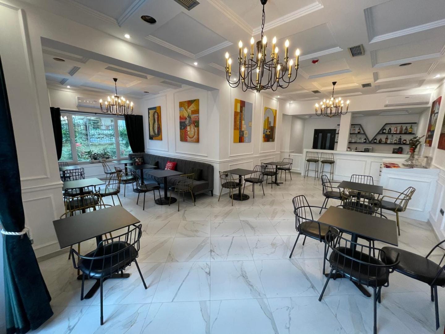 The dining room under its chandelier