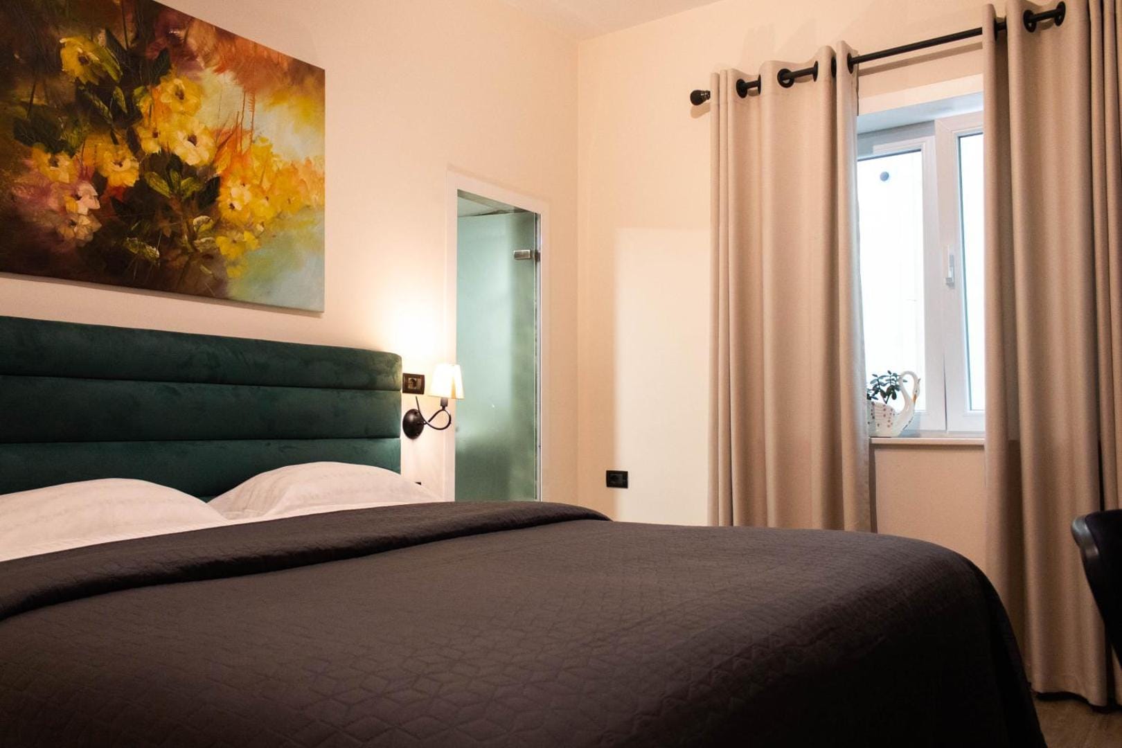 Bed with a green velvet headboard